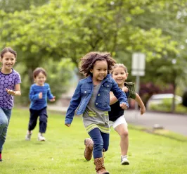 group of kids running and playing